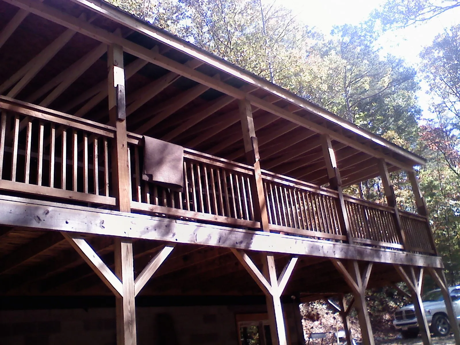 Timber framing under a new elevated porch and deck — Roof Leak Repair in Thompson by Roofing Brothers